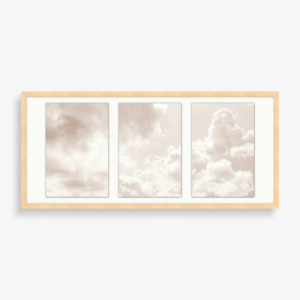 Large wall art photography featuring three cloud images overlayed with a pastel pink