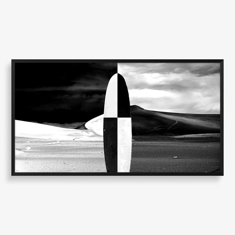 Large wall art featuring beach scene with surfboard in black and white.