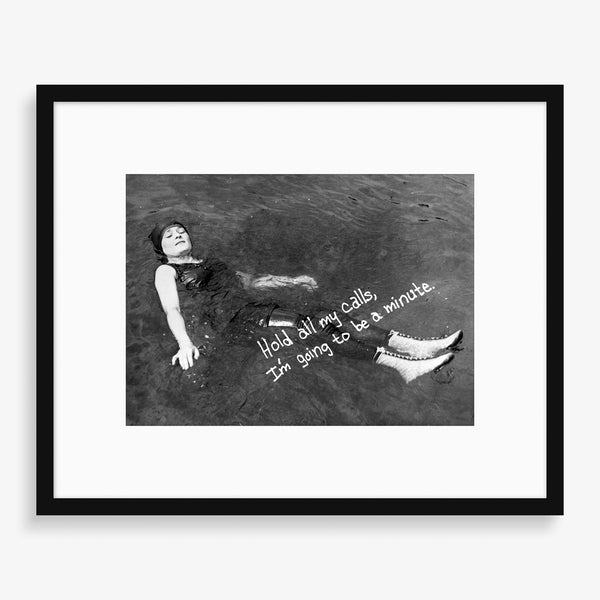 Large wall art photography piece featuring a woman swimming. 