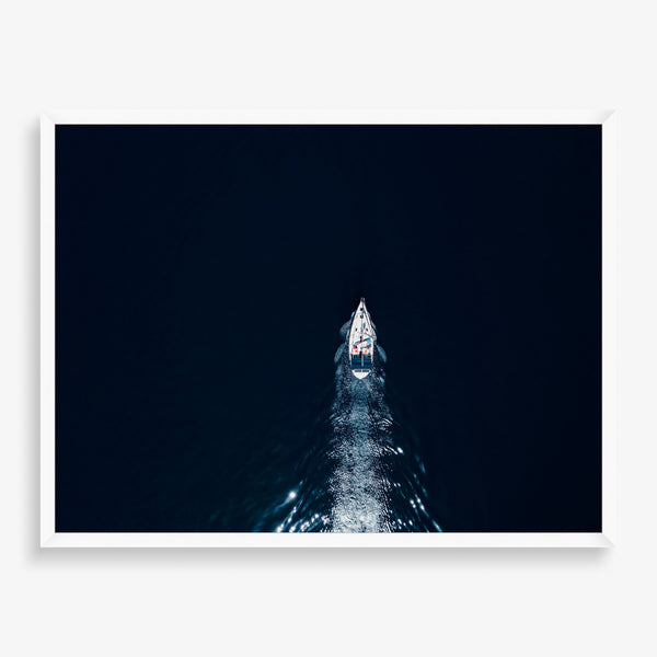 Large wall art featuring boat in deep ocean photography.