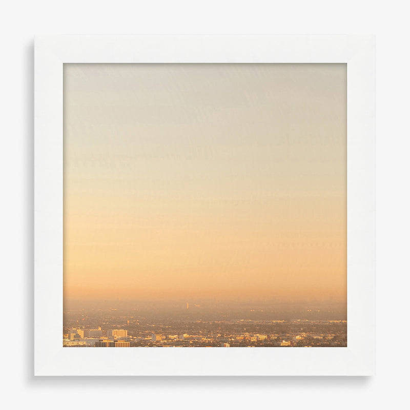 Large wall art featuring a progression photography series of sunset over Los Angeles.