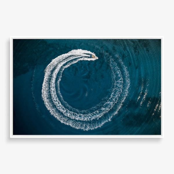 Large wall art featuring striking photography of a speed boat and a dark ocean