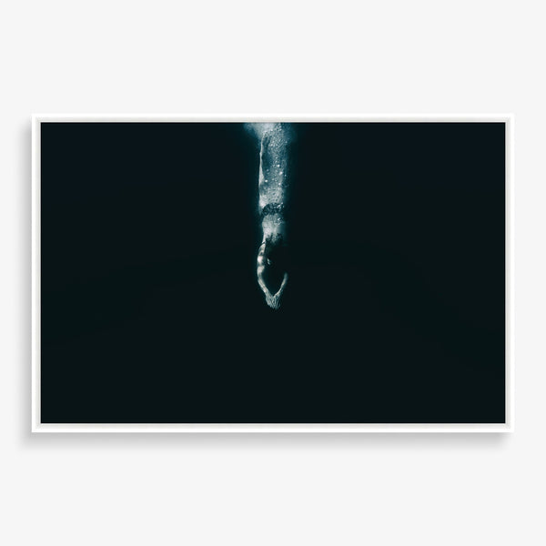 Large wall art featuring striking photography of a diver and a dark ocean