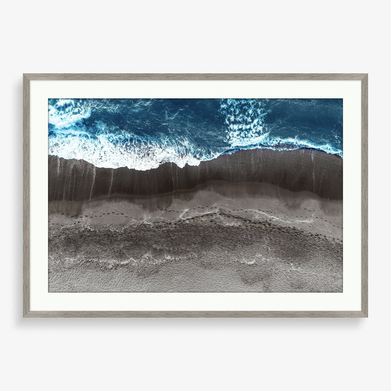 Large wall art piece featuring an abstract photography view of waves on the shore